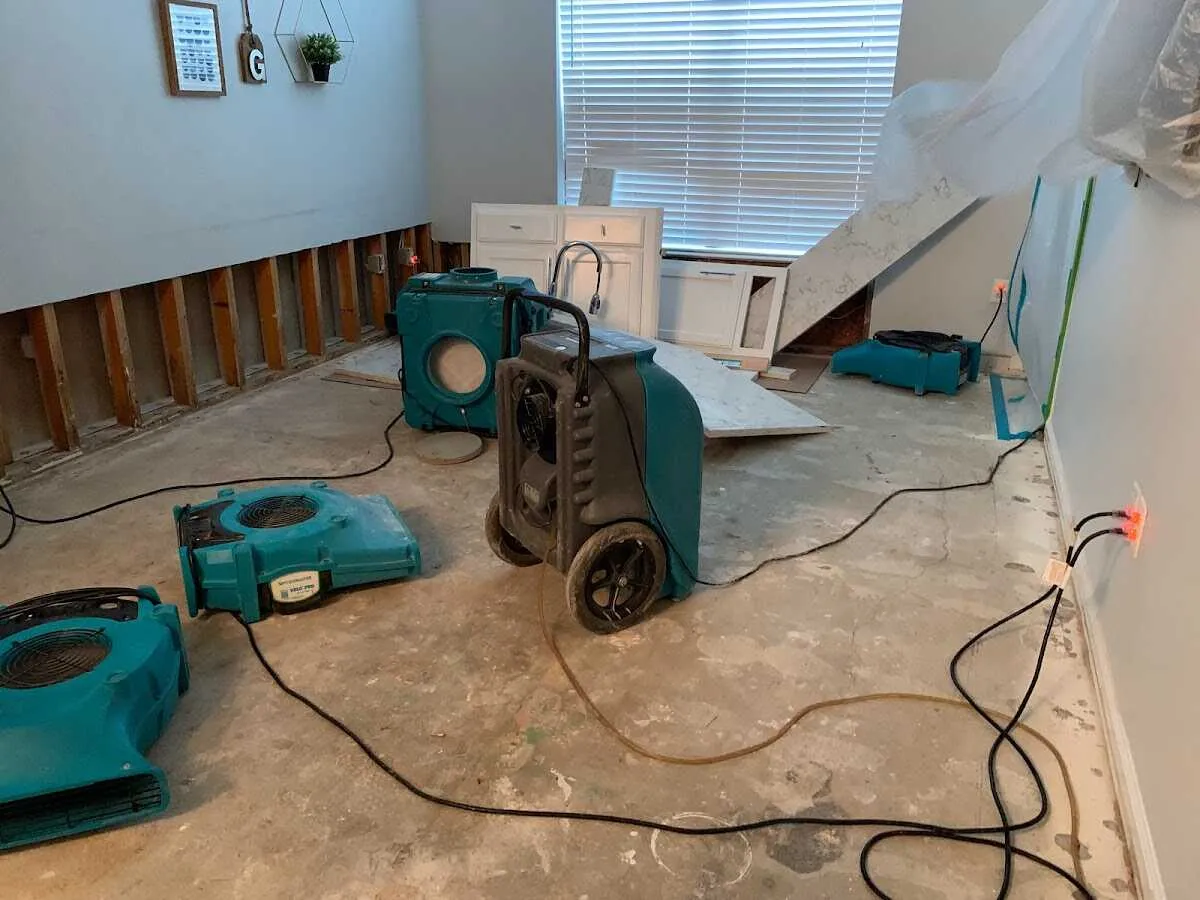 Dehumidifier in flood-cut room for Water Damage Restoration in Scott